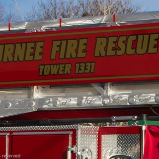 Close up shot of gold and black graphics on tower of fire and rescue ladder truck - Gurnee Fire Department.  Gurnee IL