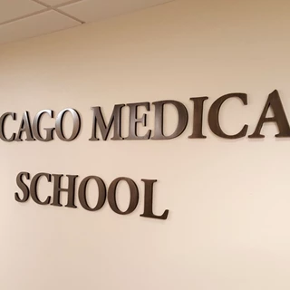 Reception cast bronze dimensional lettering on wall in North Chicago, IL
