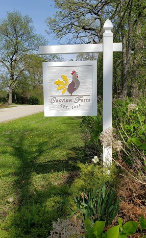 Custom carved, routed and painted roadside sign for farm.   HDU sign looks like wood.  Post is PVC.  Low maintenance