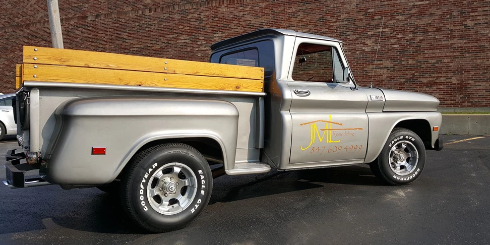 1965 Chevrolet truck with letters and phone number on door in yellow and metallic copper
