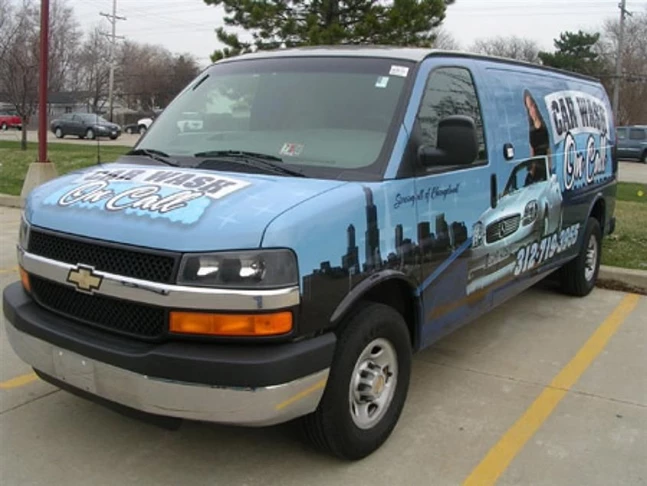 Digitally printed vinyl vehicle wrap applied to front back, sides and windows