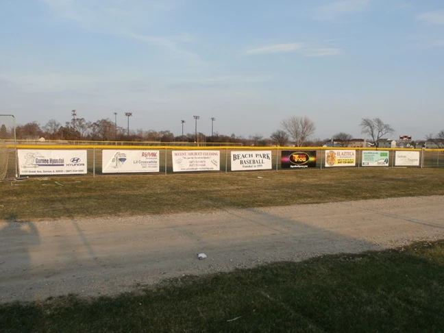 Sponsor banners on baseball field fence, Zion IL