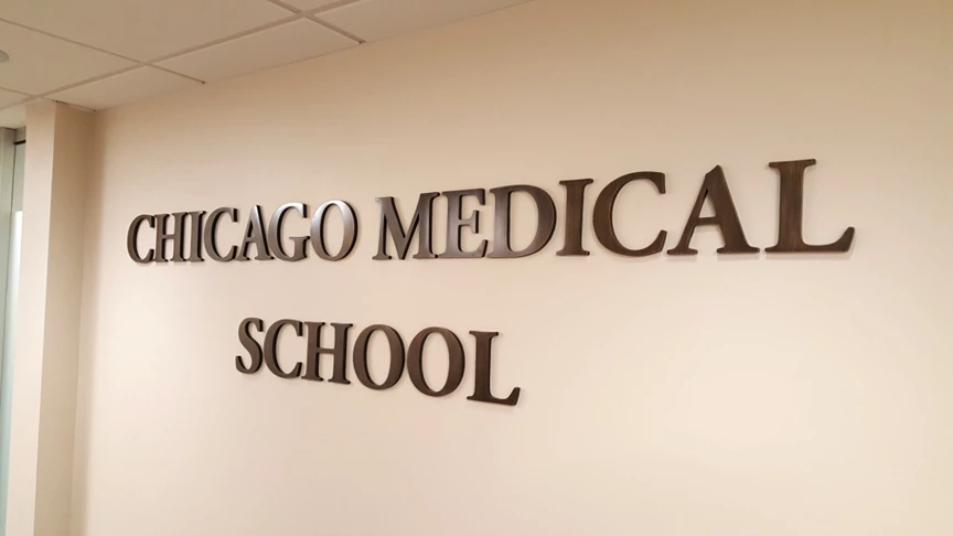 Cast bronze letters on wall for the Chicago Medical School at Rosalind Franklin University