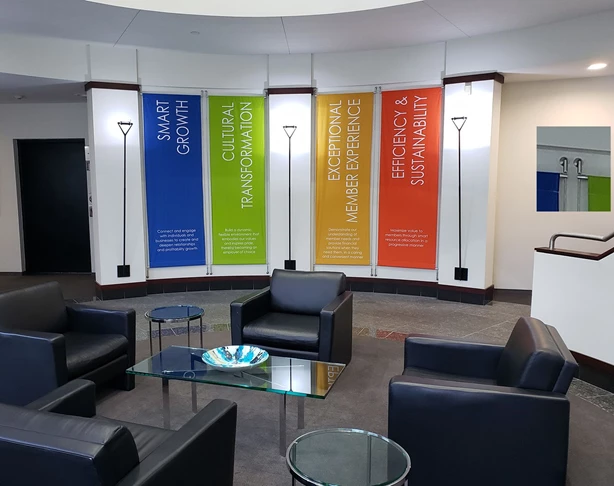 Fabric banners with stainless steel mounting system in corporate lobby